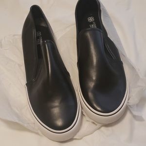 New black faux leather slip on sneakers